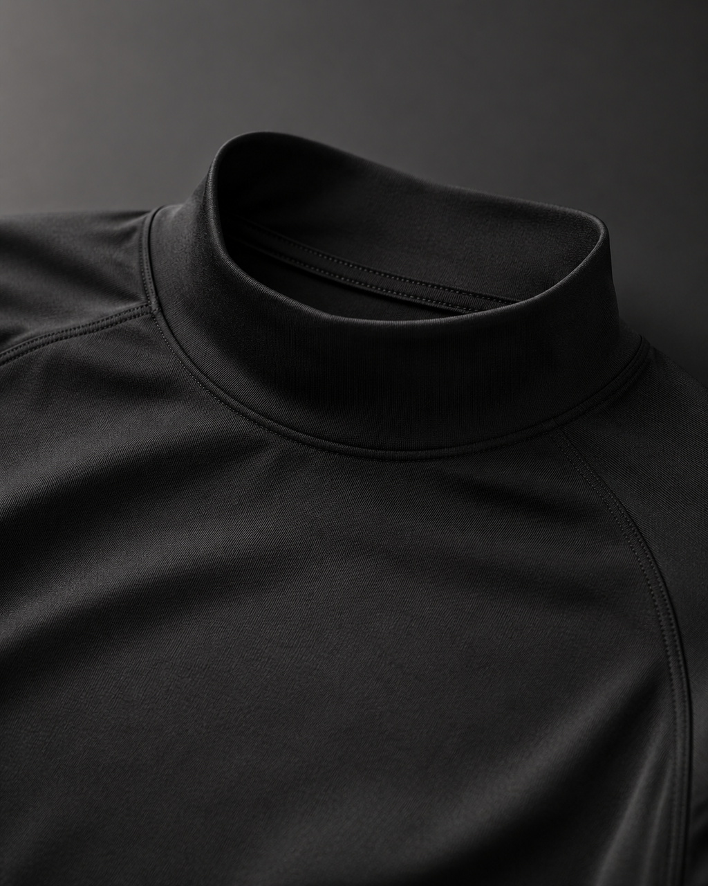 Close-up of black mock neck compression shirt collar and athletic fabric