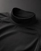 Close-up of black mock neck compression shirt collar and athletic fabric