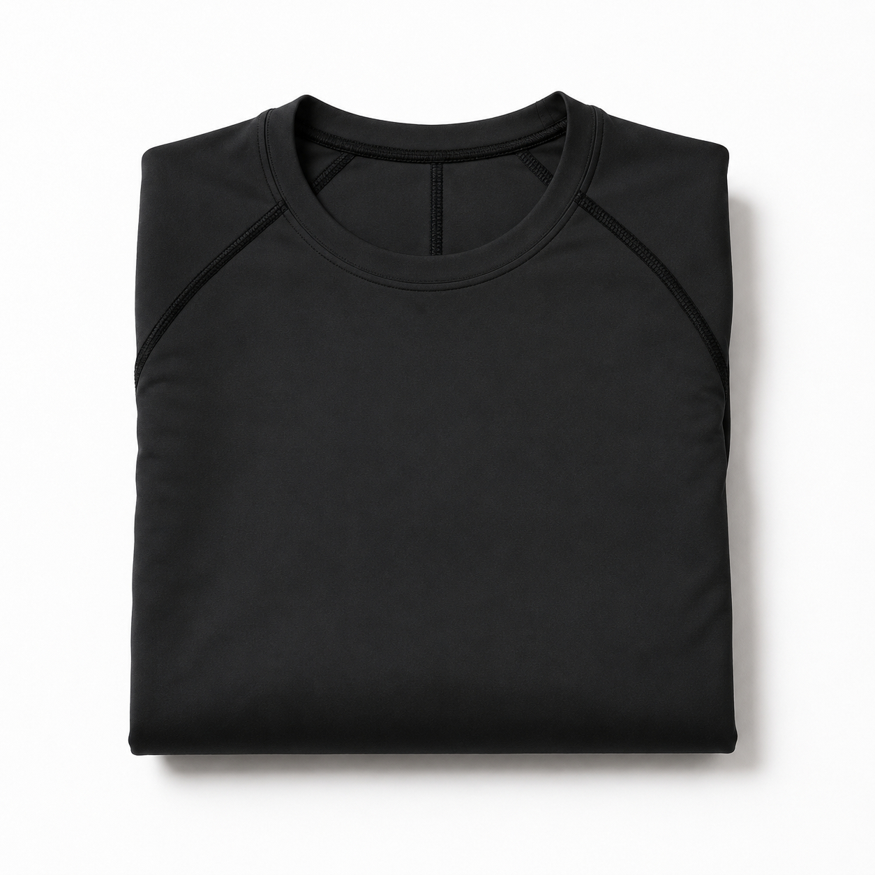 Folded black long sleeve compression shirt with crew neck and athletic seams