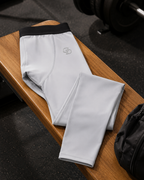 Gray leggings with a logo on a wooden surface