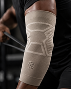 Beige compression sleeve on a person's knee with a blurred background