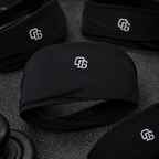 Black headbands with a logo on a textured surface
