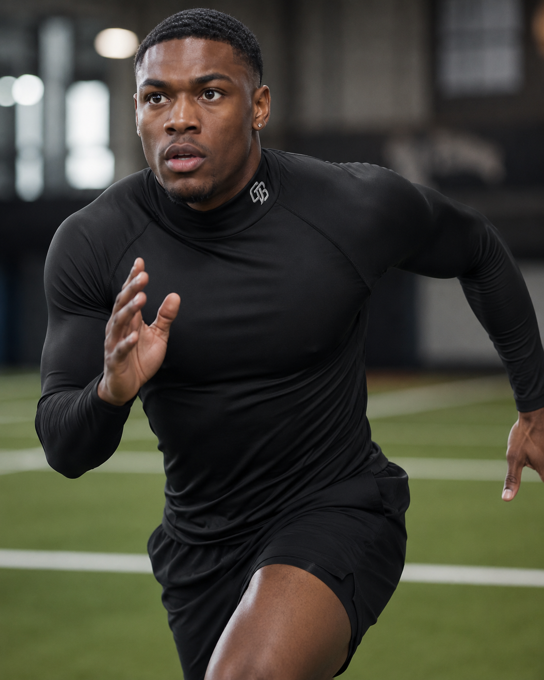 Person running on a track wearing a black athletic outfit with a brand logo.